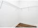 Simple walk-in closet with wire shelving and light wood-look floors at 2365 28Th Ne St, Hickory, NC 28601