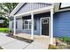 Close-up of a charming front porch with elegant columns and a stylish front door at 2365 28Th Ne St, Hickory, NC 28601