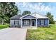 Charming blue single-story home with a well-manicured lawn and a freshly paved driveway at 2365 28Th Ne St, Hickory, NC 28601