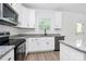 Bright kitchen featuring modern cabinets, stainless steel appliances, and granite countertops at 2365 28Th Ne St, Hickory, NC 28601