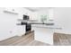 Modern kitchen featuring white cabinets, stainless steel appliances, and granite countertops at 2365 28Th Ne St, Hickory, NC 28601