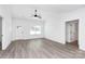 Bright living room featuring wood-look floors, a ceiling fan, and a large window letting in plenty of light at 2365 28Th Ne St, Hickory, NC 28601