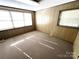 Unfinished basement area with large windows at 319 N Peterson St, Stanley, NC 28164