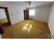 Bright bedroom featuring carpet and ample closet space at 319 N Peterson St, Stanley, NC 28164