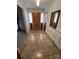 Entryway with wood door and tile floor at 319 N Peterson St, Stanley, NC 28164
