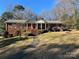 Brick ranch house with a covered porch and landscaped yard at 319 N Peterson St, Stanley, NC 28164