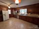 Galley kitchen with stainless steel appliances and granite countertops at 319 N Peterson St, Stanley, NC 28164