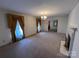 Spacious living room featuring a fireplace and large windows at 319 N Peterson St, Stanley, NC 28164