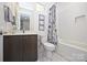 Clean bathroom with white subway tile and marble floor at 416 Wesley Heights Way, Charlotte, NC 28208