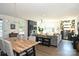 Open concept dining area with wood table and modern lighting at 416 Wesley Heights Way, Charlotte, NC 28208