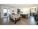 Bright dining area with wood table and access to patio at 416 Wesley Heights Way, Charlotte, NC 28208