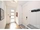 Modern entryway with white doors and hardwood floors at 416 Wesley Heights Way, Charlotte, NC 28208