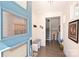 Bright and airy entryway with blue door and hardwood floors at 416 Wesley Heights Way, Charlotte, NC 28208