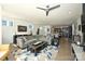 Open living room features hardwood floors, a sectional sofa, and views into the kitchen at 416 Wesley Heights Way, Charlotte, NC 28208