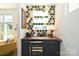 Stylish wet bar with hexagon backsplash and wine fridge at 416 Wesley Heights Way, Charlotte, NC 28208