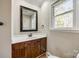 Bathroom with wood vanity, sink, and window at 4193 Walker Rd, Rock Hill, SC 29730