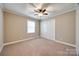 Cozy carpeted bedroom with double-door closet and ceiling fan at 4193 Walker Rd, Rock Hill, SC 29730