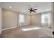 Bright bedroom with carpet, ceiling fan and two windows at 4193 Walker Rd, Rock Hill, SC 29730