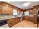 Kitchen with wood cabinets, granite counters, and stainless steel appliances at 4193 Walker Rd, Rock Hill, SC 29730