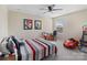 Bright bedroom featuring a ceiling fan, neutral walls, and a red car bed for a playful touch at 490 Melvista Ave, Rock Hill, SC 29732
