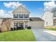 Charming two-story home with a well-manicured lawn, attached garage, and welcoming curb appeal at 490 Melvista Ave, Rock Hill, SC 29732