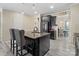 Stylish kitchen island with barstool seating, stainless steel refrigerator and ample cabinet space at 490 Melvista Ave, Rock Hill, SC 29732