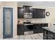 Modern kitchen featuring stainless steel appliances, granite countertops, and charming blue pantry door at 490 Melvista Ave, Rock Hill, SC 29732