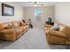 Spacious living room featuring two comfortable leather couches and a television set for relaxation and entertainment at 490 Melvista Ave, Rock Hill, SC 29732