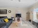 Inviting living room features a leather sofa, modern decor, and a view of the open floor plan at 490 Melvista Ave, Rock Hill, SC 29732