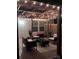 Nighttime view of a covered patio with stylish furniture and decorative string lights, creating a relaxing ambiance at 490 Melvista Ave, Rock Hill, SC 29732