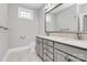 Elegant bathroom with double vanity, granite countertop and large mirror at 535 Chalmers Row, Rock Hill, SC 29732