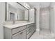Modern bathroom featuring double vanity, shower, and storage at 535 Chalmers Row, Rock Hill, SC 29732