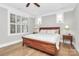 Bright bedroom with hardwood floors, plantation shutters and a ceiling fan at 535 Chalmers Row, Rock Hill, SC 29732