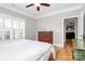 Spacious bedroom with hardwood floors, dresser, and ceiling fan at 535 Chalmers Row, Rock Hill, SC 29732