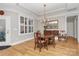 Elegant dining room with hardwood floors, chandelier, and built-in hutch at 535 Chalmers Row, Rock Hill, SC 29732