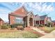 Brick home with stone accents and landscaped yard at 535 Chalmers Row, Rock Hill, SC 29732