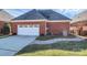 Attached brick garage with driveway and stone walkway at 535 Chalmers Row, Rock Hill, SC 29732