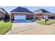 Attached brick garage with driveway and landscaping at 535 Chalmers Row, Rock Hill, SC 29732