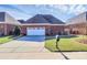Attached brick garage with driveway and landscaping at 535 Chalmers Row, Rock Hill, SC 29732