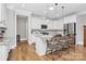 Modern kitchen with white cabinets, granite countertops and island seating at 535 Chalmers Row, Rock Hill, SC 29732