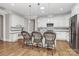Modern kitchen with white cabinets, granite countertops, and island seating at 535 Chalmers Row, Rock Hill, SC 29732