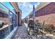 Stone patio with seating area and adjacent sunroom at 535 Chalmers Row, Rock Hill, SC 29732