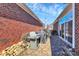 Brick patio with grill, table, and chairs; perfect for outdoor entertaining at 535 Chalmers Row, Rock Hill, SC 29732