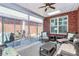 Relaxing sunroom with wicker furniture and access to patio at 535 Chalmers Row, Rock Hill, SC 29732