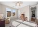 Well-lit bedroom with two windows and a comfortable sitting area at 8829 Bur Ln, Huntersville, NC 28078