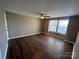 Bright bedroom with laminate floors and a mirrored closet at 9401 Old Concord Rd # K, Charlotte, NC 28213