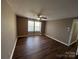 Spacious bedroom with laminate wood floors and large windows at 9401 Old Concord Rd # K, Charlotte, NC 28213