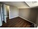 Small bedroom with laminate flooring and access to a closet at 9401 Old Concord Rd # K, Charlotte, NC 28213