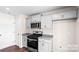 Modern kitchen with gray cabinets, granite countertops, and stainless steel appliances at 1029 20Th Avenue Se Loop, Hickory, NC 28602