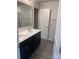 Bathroom with dark vanity and double sinks at 104 Springdale St, Shelby, NC 28150